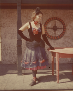 Image of Fandangle Costume - Marilynne Howsley Myers with Hand on Table