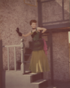 Image of Fandangle Costume - Maida Bee Scott with Hand on Wall