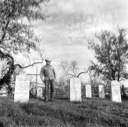 Image of Watt Matthews Standing in Family Cemetery